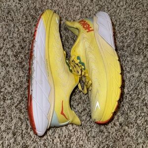 Hoka Yellow Running Shoes with Red Accents